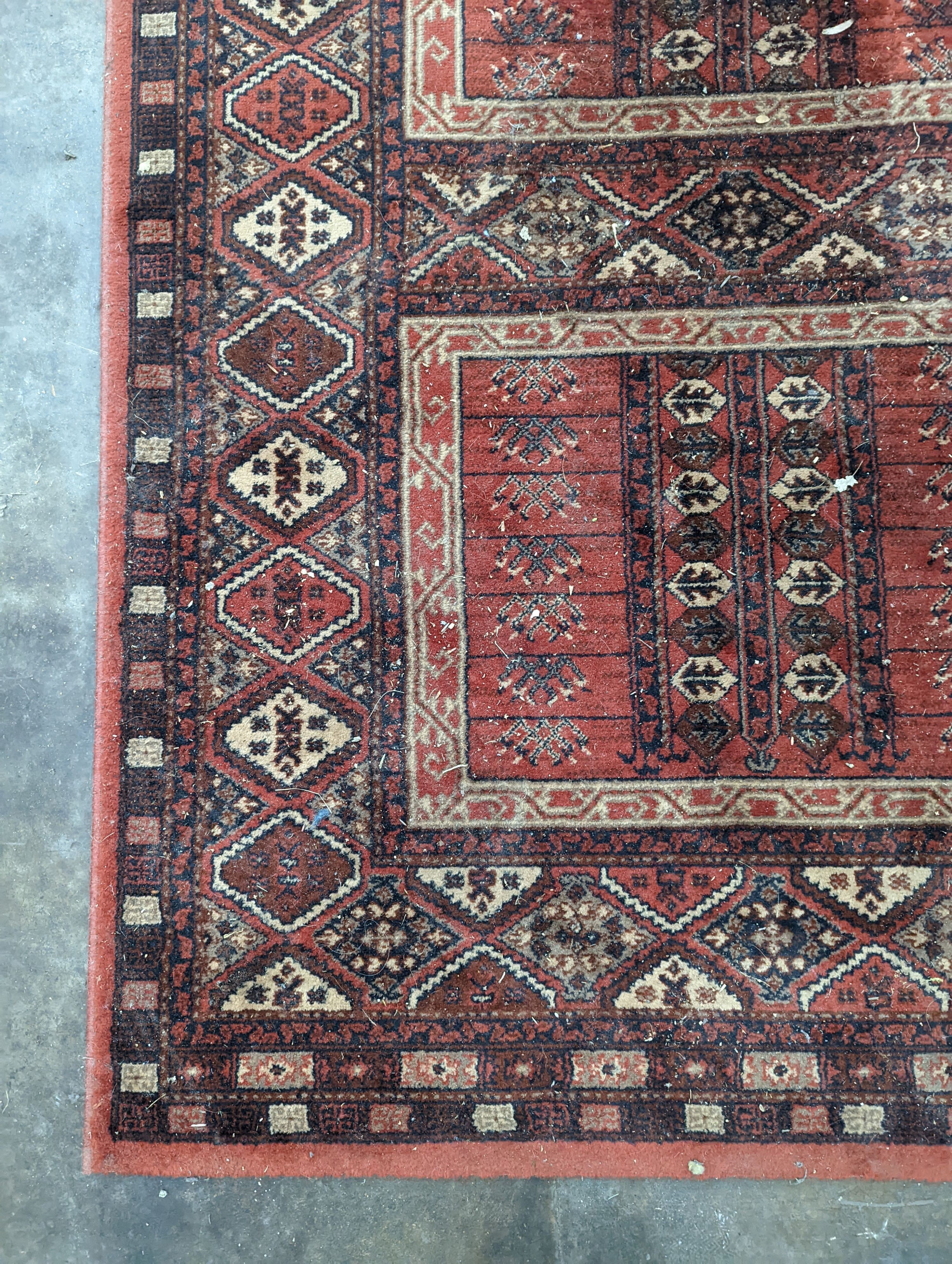 A Caucasian red ground rug, 190 x 136cm